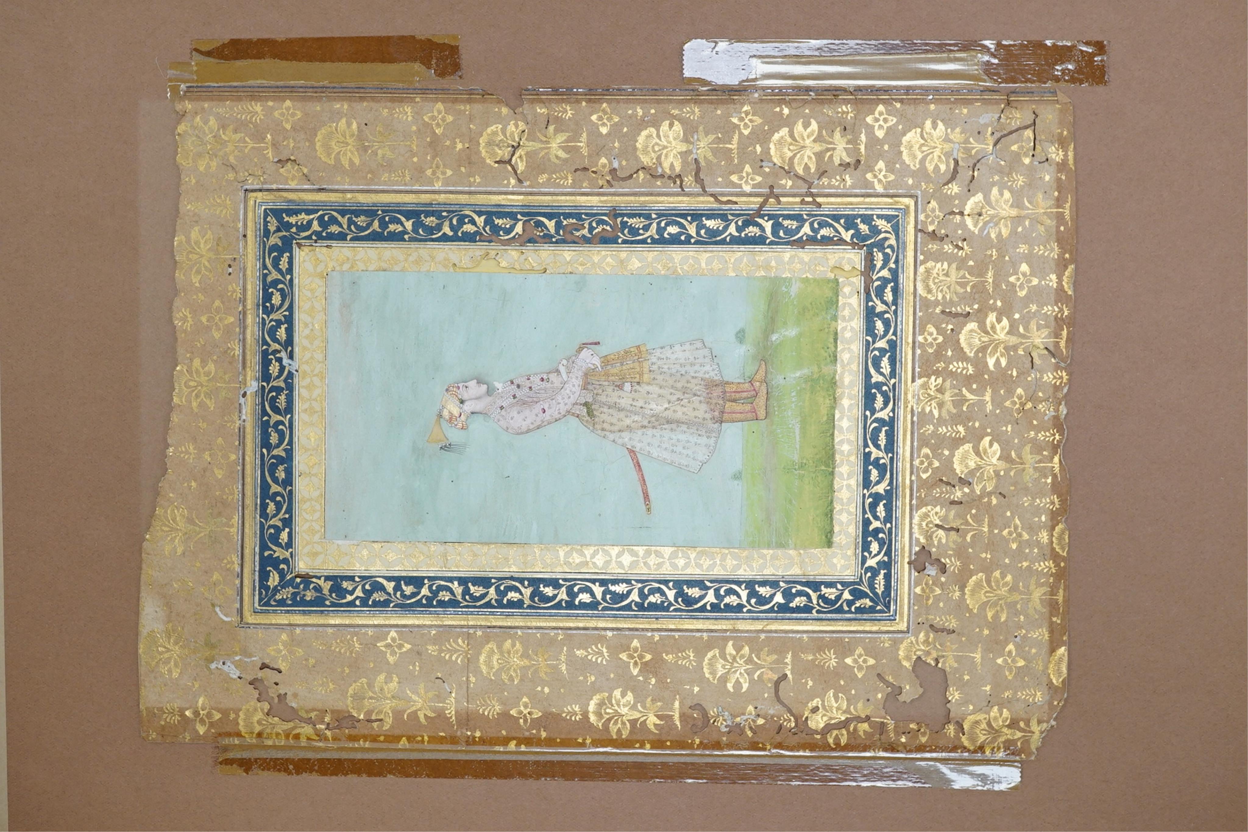Mogul (Mughal) School , Profile Portrait of a Mogul dignitary, possibly Shah Jahan (1592-1666), full length, wearing court attire and a sword, standing in a landscape, watercolour miniature, 31cm x 20.5cm including borde